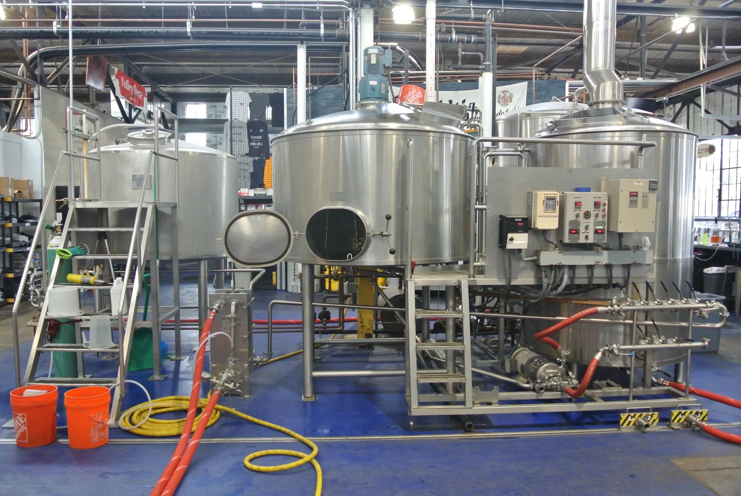 Mash tun and brewhouse interior at von C Brewing Co. — the grain bill mills here before lautering, hot side production for the Schmidt's-tradition lager lineup